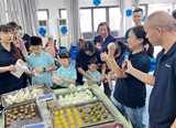 Nouryon Ningbo site Open-to-Public Day event - site employees make cake for the elderly