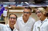 Three Nouryon colleagues in a lab with safety glasses