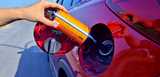 Fuel additive being added to car