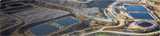 Mining operations showing solvent extraction, leaching heaps and storage reservoirs