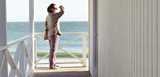 Woman outside her beach house look out at the sea view. Discover Nouryon’ s portfolio of thickeners, stabilizers, water retaining agents, lightweight fillers and more for water-based decorative paints and coatings.