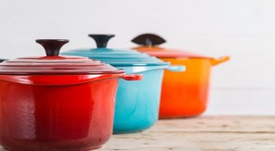 Colorful ceramic-coated pans—used to represent industrial coatings in the paints, coatings, and inks market segment.