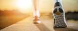 Walking while revealing the sole of a sports shoe