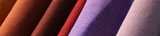 Close-up of rolls with fabric in vibrant colors. Nouryon supplies the textile and fabric industry with key components for use both with natural and synthetic fibers. For example, chelates that help to protect and improve color.