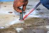Injection adhesive chemical into hole for preparation anchor bolt 