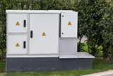 Outdoor plastic control cabinet with warning signs
