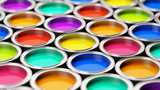 Open buckets with colorful paints