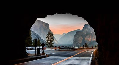 Road entry into tunnel with nice nature scenery in the background.