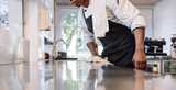 A man cleaning and maintaining commercial kitchen hygiene. Nouryon’s biocides, specialty surfactants and chelates are widely used in industrial and institutional disinfectants and cleaning formulations.