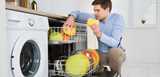 Young Happy Man Arranging Dishes In Dishwasher In Modern Kitchen. Nouryon’s technologies – surfactants, chelating agents, biopolymers, polymers – provides the functionalities to enhance detergents for automatic dishwashers. 
