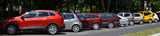 Several colorful cars parked.