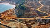 Mining site next to body of water.
