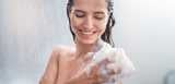 Girl taking shower with gel, washing with puff. Our portfolio of high-quality polymers, biopolymers and specialty surfactants created for high-performing color cosmetics, hair, skin and sun care formulations. 
