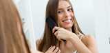 Young woman brushing her long hair in front of mirror. Formulate consumer-driven and efficient hair care products with our conditioning agents, film formers, rheology modifiers, emulsifiers and moisturizers. We provide polymers, biopolymers, specialty surfactants and cellulose ethers. 