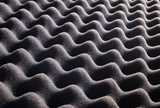 A piece of black ribbed foam rubber
