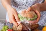 Wrapping plastic film around a sandwich