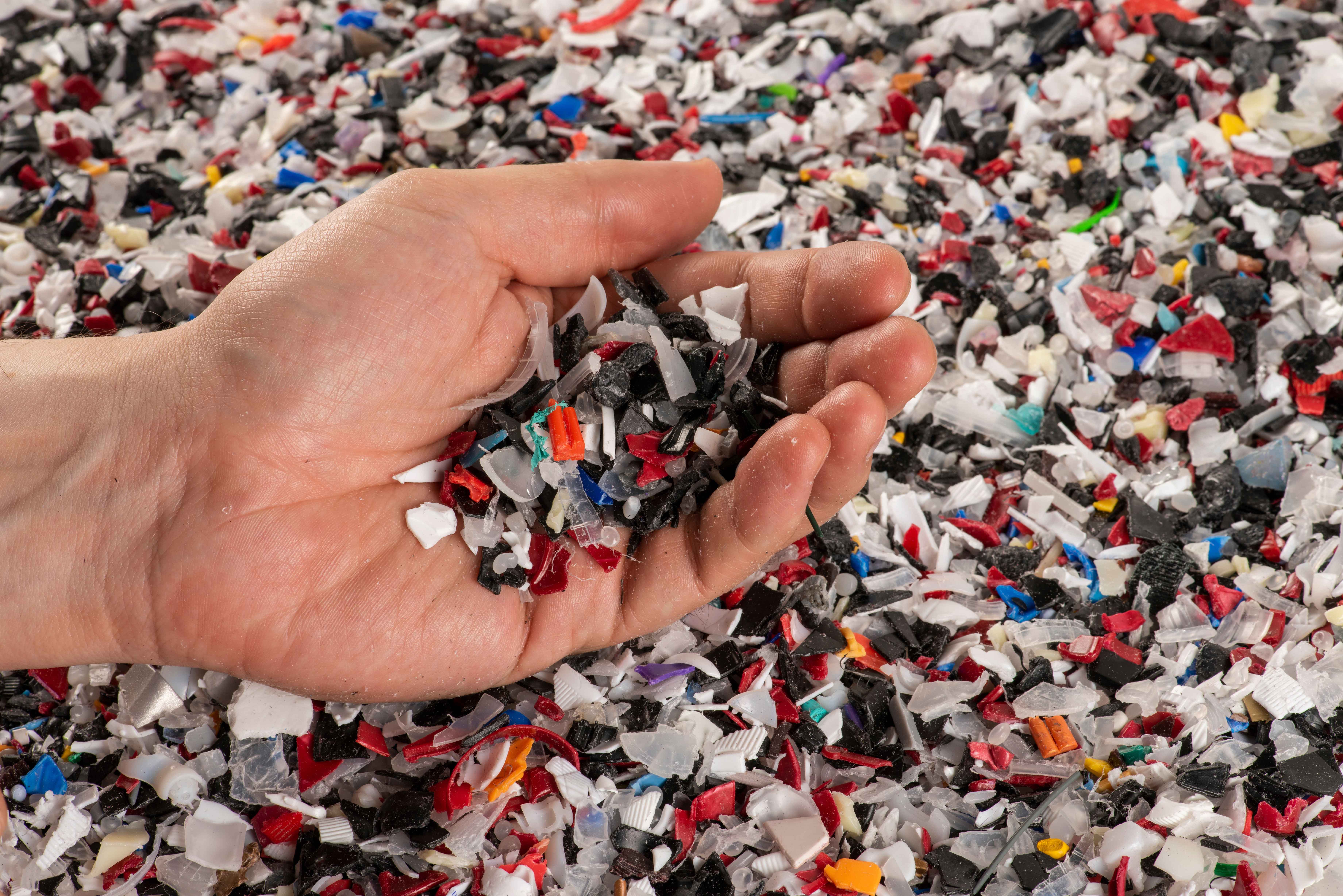 Hand holding plastic waste snipes
