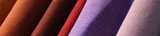 Close-up of rolls with fabric in vibrant colors. Nouryon supplies the textile and fabric industry with key components for use both with natural and synthetic fibers. For example, chelates that help to protect and improve color.