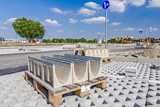 Symmetrical rectangular precast rainwater canal on a pallet.