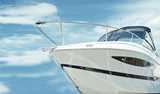 A close-up view of the front of a white yacht