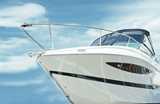 A close-up view of the front of a white yacht