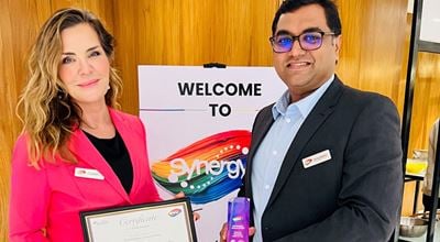 Sirpa Engman and Pratik Dabhekar with the award